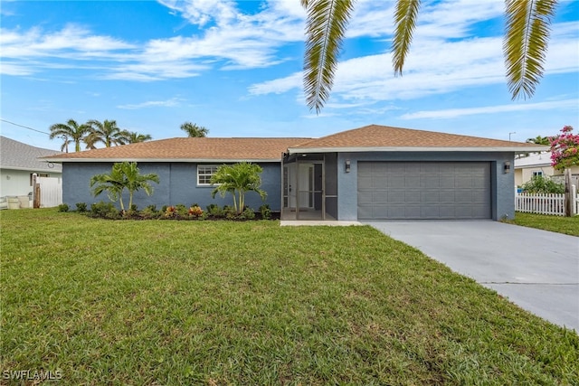 ranch-style home with a front yard and a garage