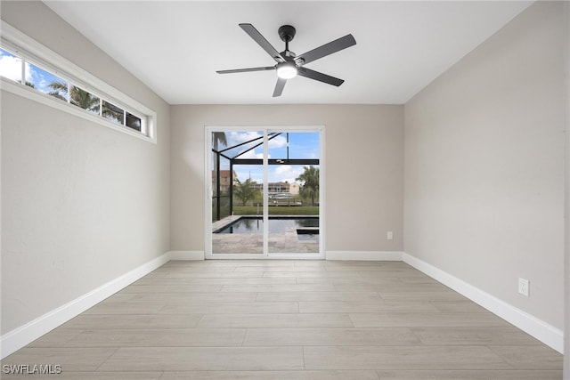 unfurnished room with ceiling fan and light hardwood / wood-style flooring