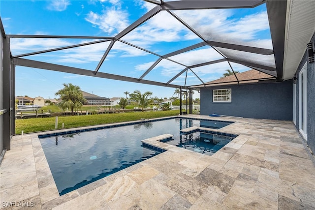 view of pool featuring an in ground hot tub, a patio, a water view, and a lanai