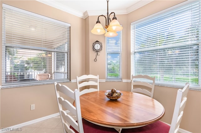 dining area with a chandelier, light tile patterned floors, and crown molding