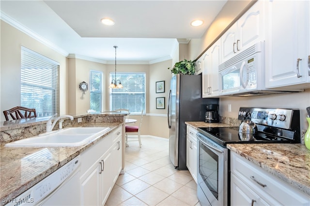 kitchen featuring an inviting chandelier, sink, hanging light fixtures, appliances with stainless steel finishes, and white cabinetry