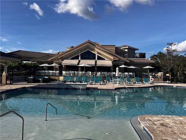 view of swimming pool with a patio