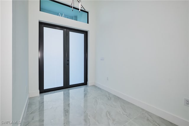 foyer entrance featuring french doors