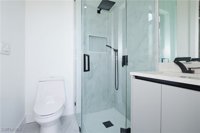 bathroom featuring vanity, toilet, and walk in shower