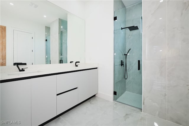 bathroom with vanity and walk in shower