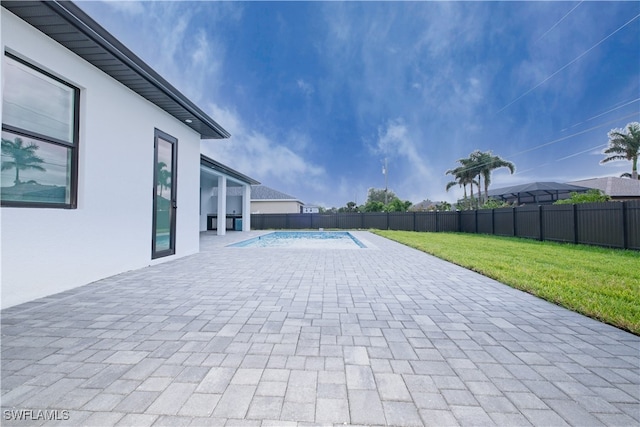 view of patio / terrace with a fenced in pool