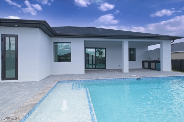 view of swimming pool featuring a patio and area for grilling