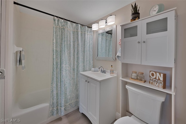 1 Bluebill Ave Unit 401, Naples, FL 34108 - bathroom featuring vanity, shower / tub combo with curtain, and toilet