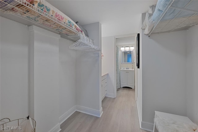1 Bluebill Ave Unit 401, Naples, FL 34108 - spacious closet with a sink and light wood-type flooring