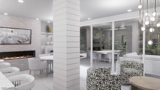 bathroom with a fireplace and ornate columns