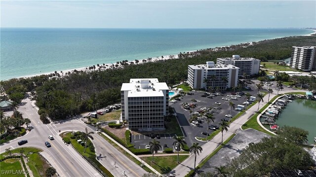 1 Bluebill Ave Unit 401, Naples, FL 34108 - view of property's community with a beach view and a deck with water view