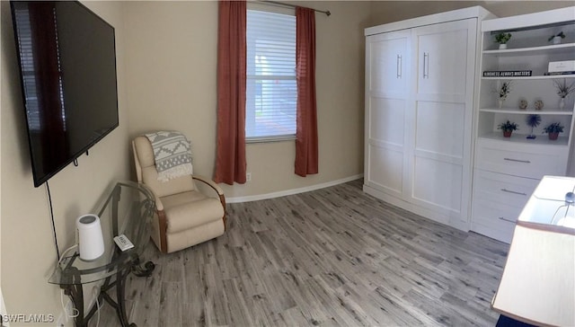 unfurnished room with light hardwood / wood-style floors