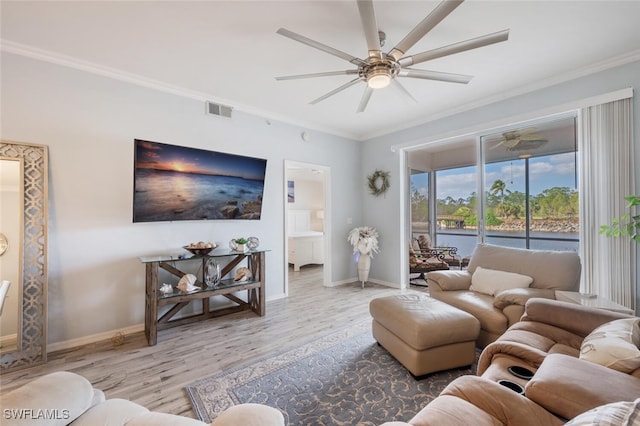 living room featuring crown molding, ceiling fan, and light wood-type flooring