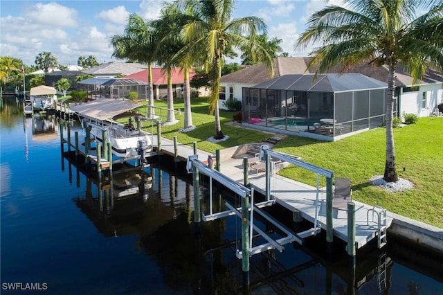 dock area featuring a lanai, a lawn, a water view, and a patio