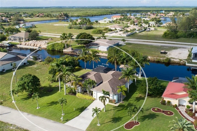 drone / aerial view with a water view