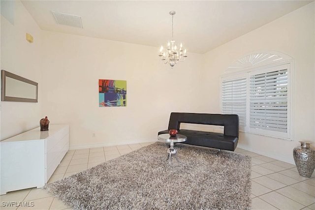 living area featuring a chandelier and light tile patterned floors