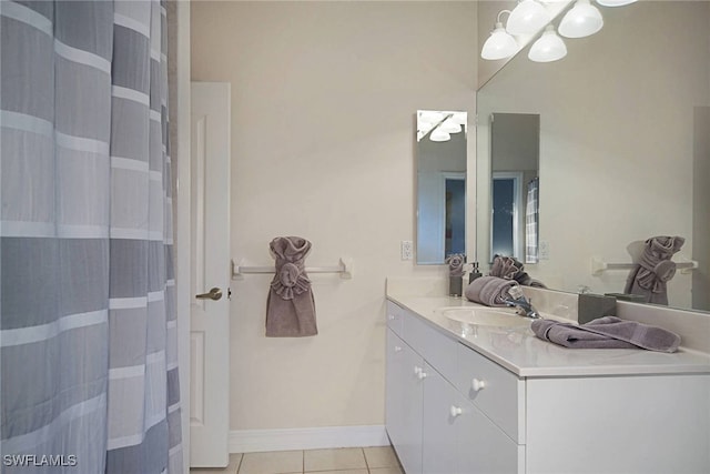 bathroom with tile patterned flooring and vanity