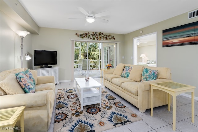 living room with ceiling fan and light tile patterned floors