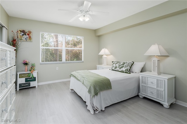 bedroom with hardwood / wood-style flooring and ceiling fan