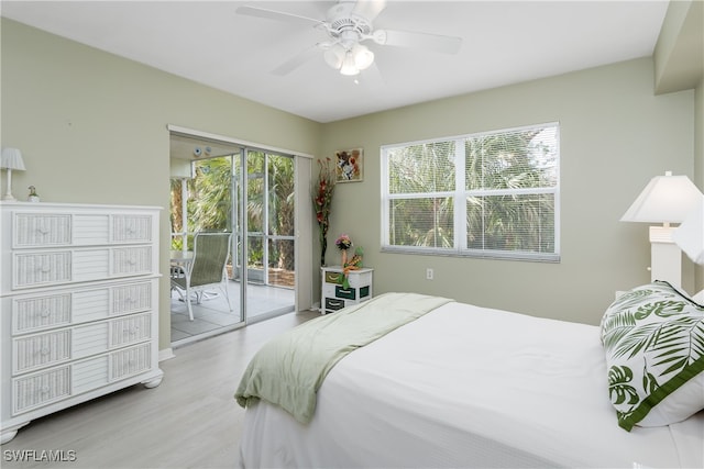 bedroom featuring ceiling fan, light hardwood / wood-style flooring, access to outside, and multiple windows