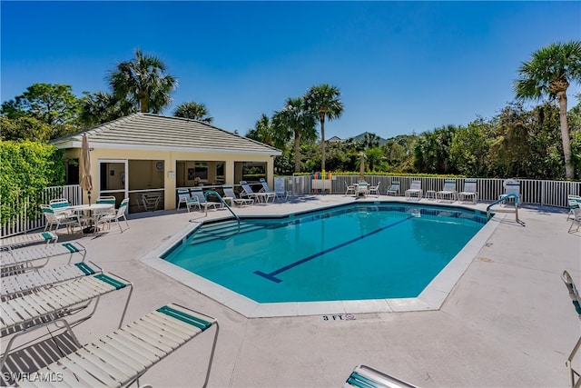 view of swimming pool featuring a mountain view and a patio area