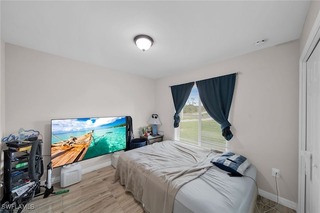 bedroom with light hardwood / wood-style flooring