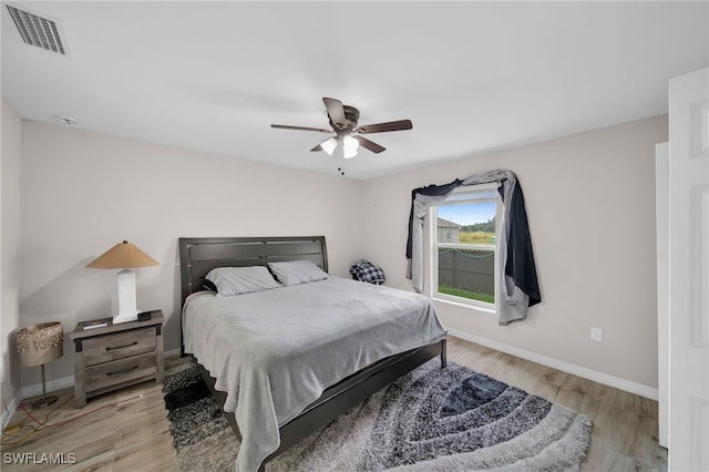 bedroom featuring ceiling fan and light hardwood / wood-style flooring