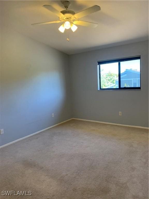 13508 Siesta Pines Ct Unit 8, Fort Myers, FL 33908 - empty room featuring a ceiling fan and carpet flooring