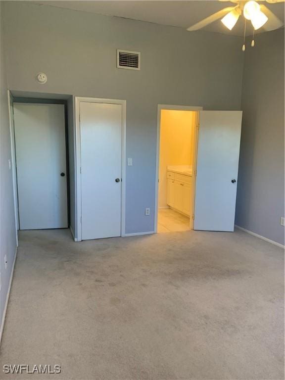 13508 Siesta Pines Ct Unit 8, Fort Myers, FL 33908 - unfurnished bedroom featuring light colored carpet and ensuite bath