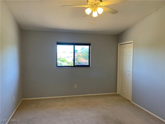 13508 Siesta Pines Ct Unit 8, Fort Myers, FL 33908 - spare room featuring light colored carpet and ceiling fan