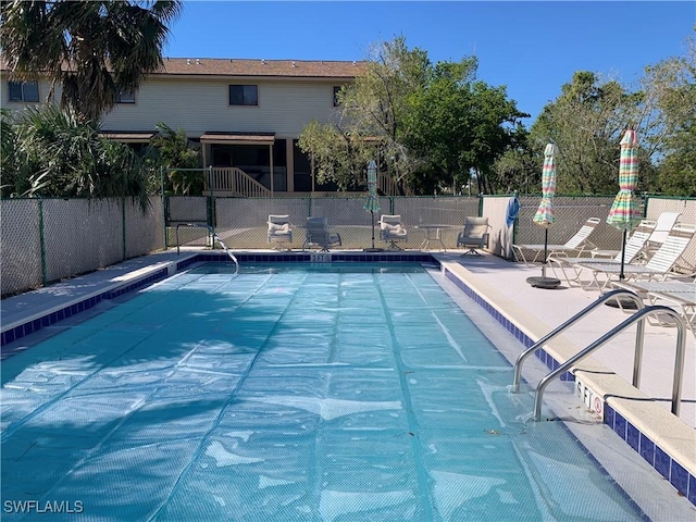 view of swimming pool with a patio area