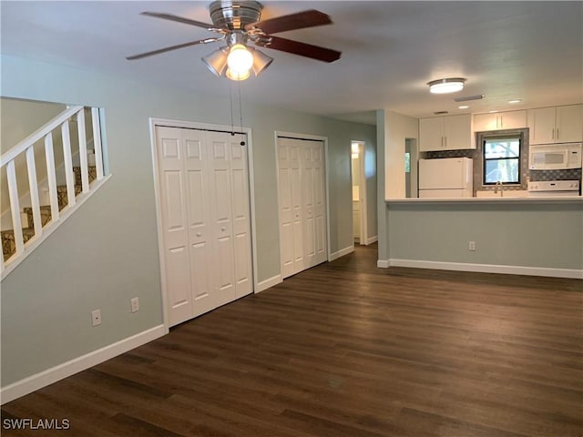 13508 Siesta Pines Ct Unit 8, Fort Myers, FL 33908 - unfurnished living room featuring dark wood-style flooring, a ceiling fan, and stairway