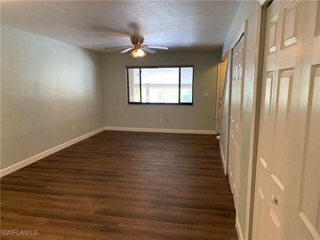 13508 Siesta Pines Ct Unit 8, Fort Myers, FL 33908 - spare room with a ceiling fan and dark wood-style floors