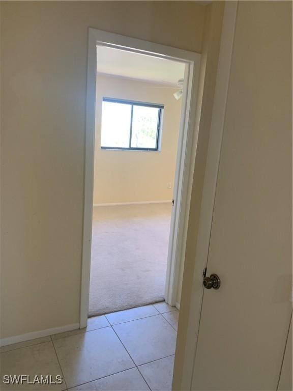 13508 Siesta Pines Ct Unit 8, Fort Myers, FL 33908 - hall featuring light carpet and light tile patterned floors