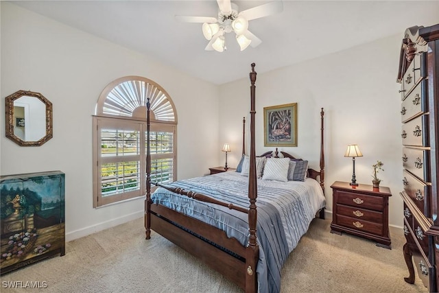 bedroom with light carpet, ceiling fan, and baseboards