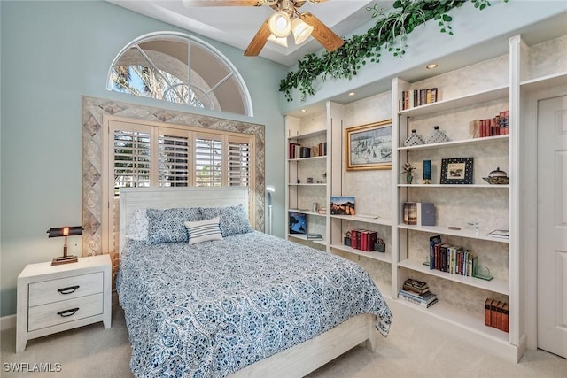 bedroom with multiple windows and light colored carpet