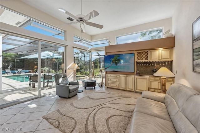 sunroom / solarium with ceiling fan and visible vents