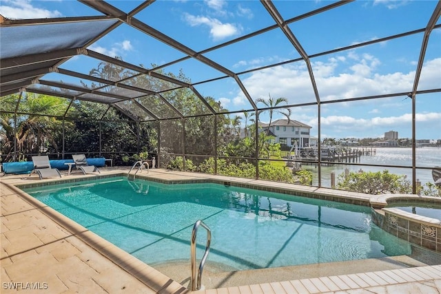 view of pool featuring a patio, a water view, a lanai, and a pool with connected hot tub