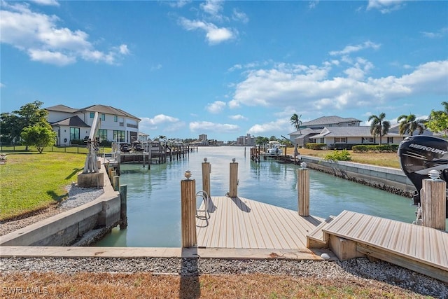 dock area with a residential view and a water view