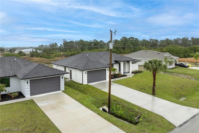 ranch-style home featuring a garage and a front yard