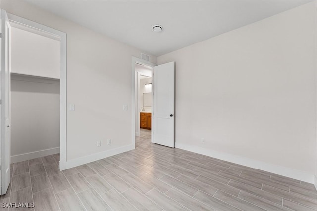 unfurnished bedroom featuring a closet