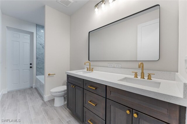 full bathroom featuring shower / washtub combination, toilet, and vanity