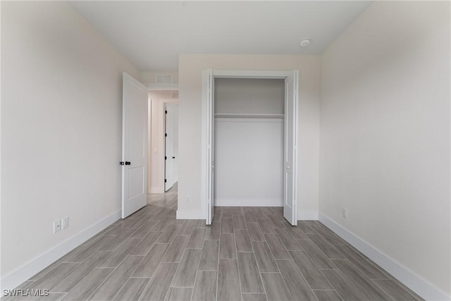 unfurnished bedroom with a closet