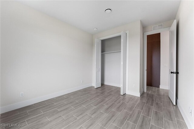 unfurnished bedroom with a closet