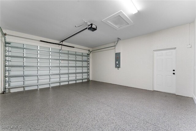 garage featuring a garage door opener and electric panel