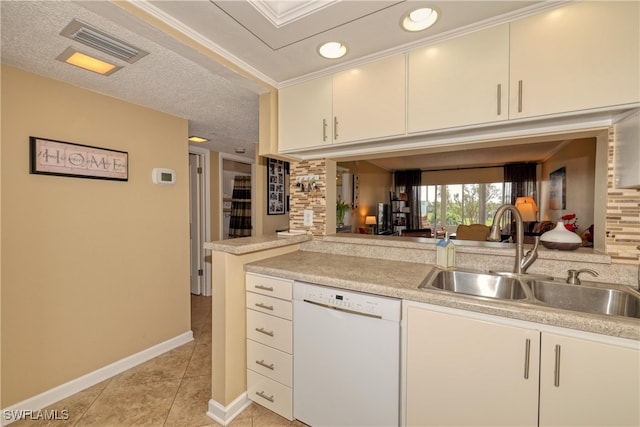 kitchen featuring dishwasher, sink, kitchen peninsula, a textured ceiling, and light tile patterned floors