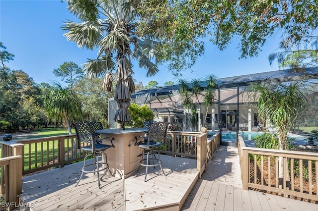 wooden deck with glass enclosure and outdoor dry bar