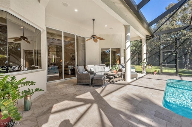 view of patio featuring a ceiling fan, glass enclosure, outdoor lounge area, and an outdoor pool