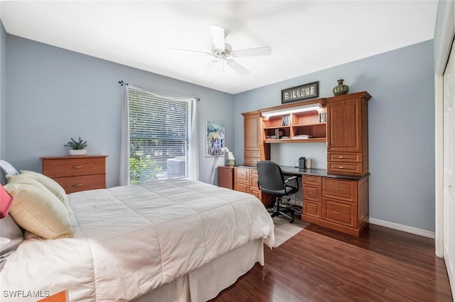 bedroom with a ceiling fan, baseboards, and dark wood-style flooring