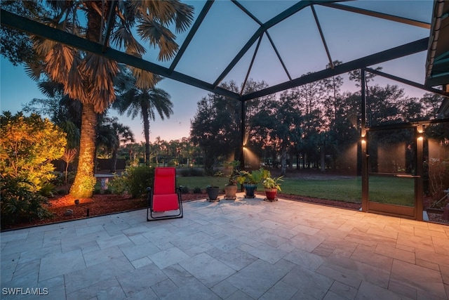 view of patio / terrace featuring a lanai